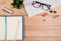 Office desk table workplace with computer keyboard, glasses, calculator, pen, pencil and open notebook and ribbon bookmarkÃ Â¹Æ